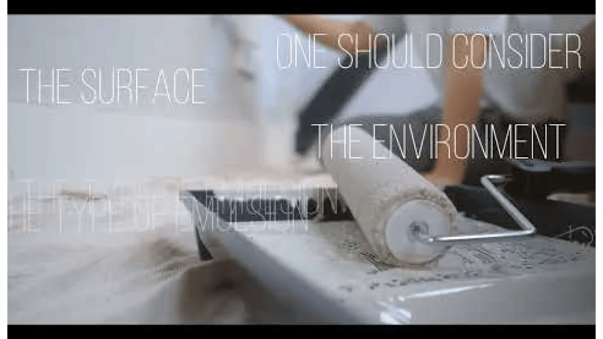 A paint roller rests on a tray filled with paint, while blurred hands work in the background. Overlay text reads: THE SURFACE, ONE SHOULD CONSIDER, THE ENVIRONMENT, and THE TYPE OF EMULSION.