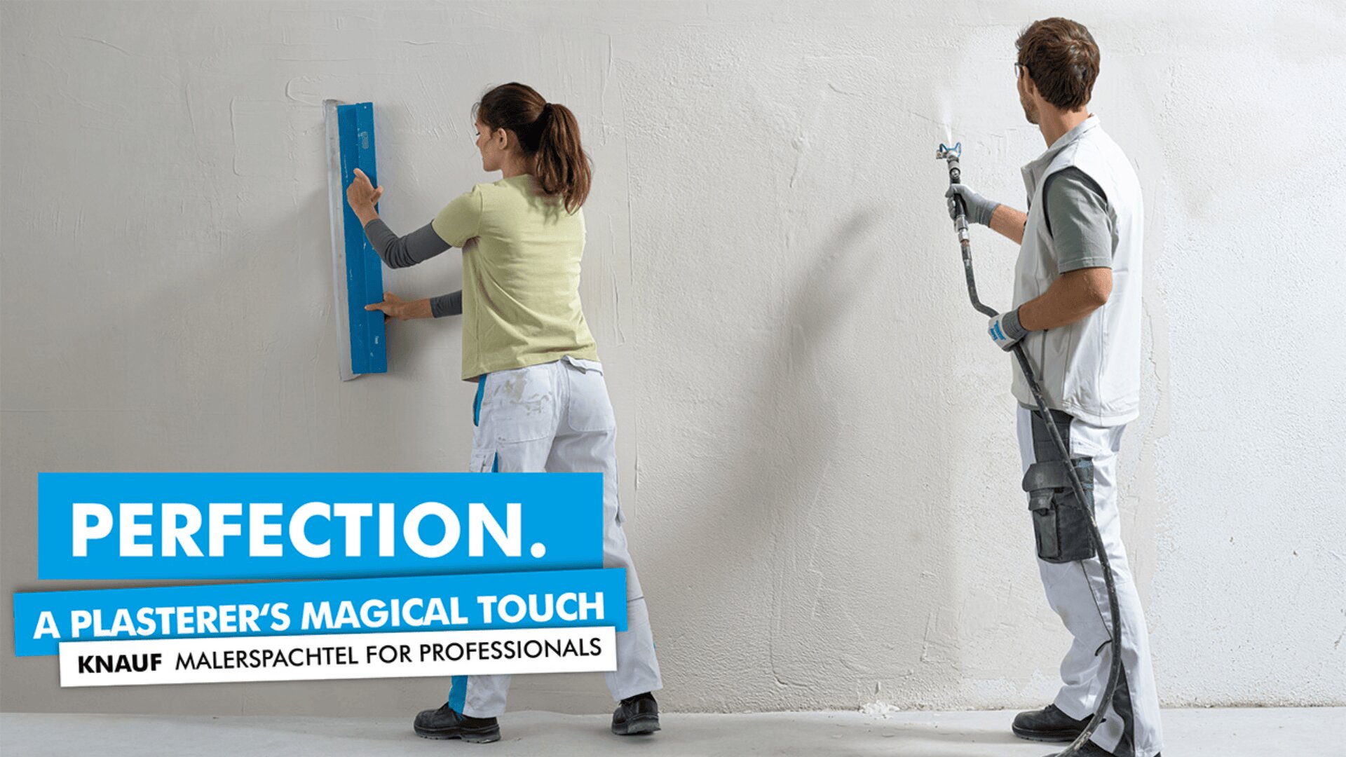 A woman smooths plaster on a wall with a blue tool while a man watches and holds plastering equipment. Text overlay reads, PERFECTION. A PLASTERER’S MAGICAL TOUCH. KNAUF MALERSPACHTEL FOR PROFESSIONALS.
