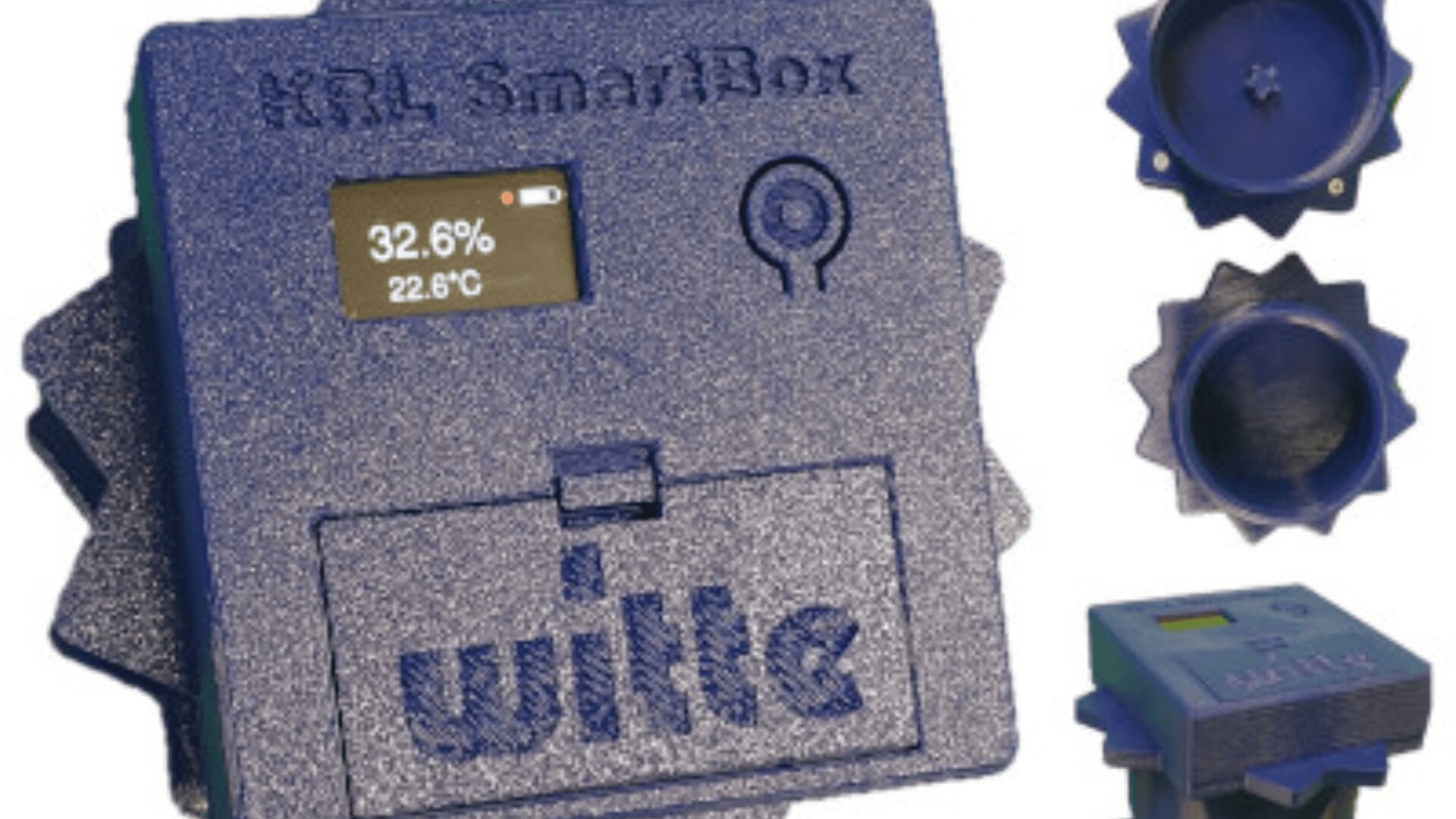 Ein blaues Wille H&L SmartBox-Gerät zeigt auf einem kleinen Bildschirm 32,6 % und 22,6 °C an. Mehrere Ansichten des Geräts zeigen die strukturierten, zahnradförmigen Seiten und die beschriftete Vorderseite.